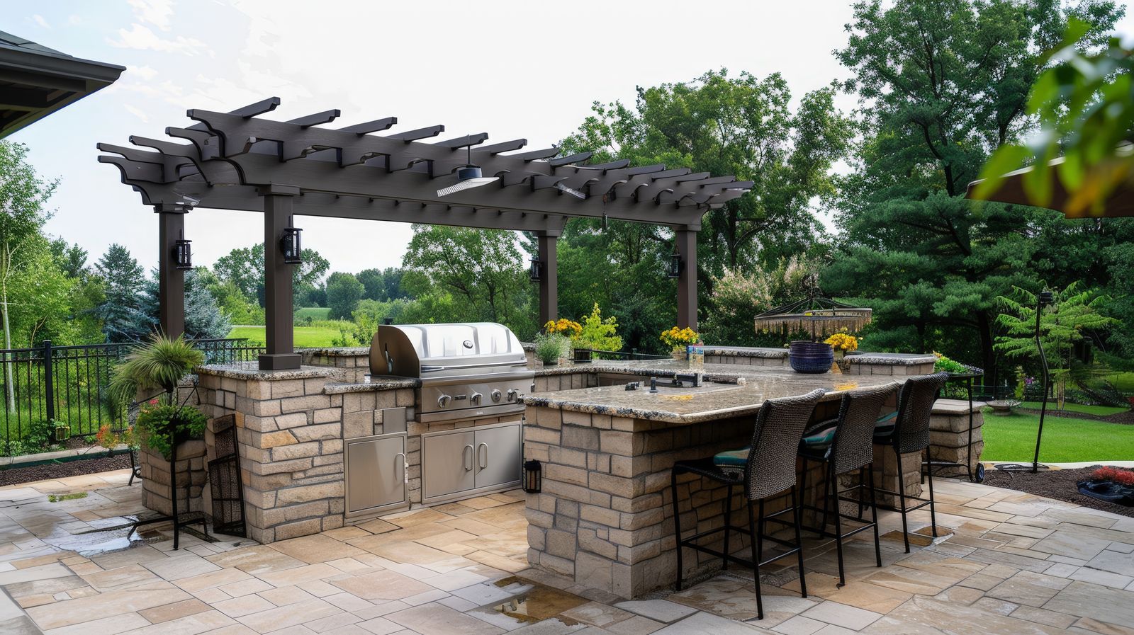 Outdoor kitchen and bar beside a backyard pool